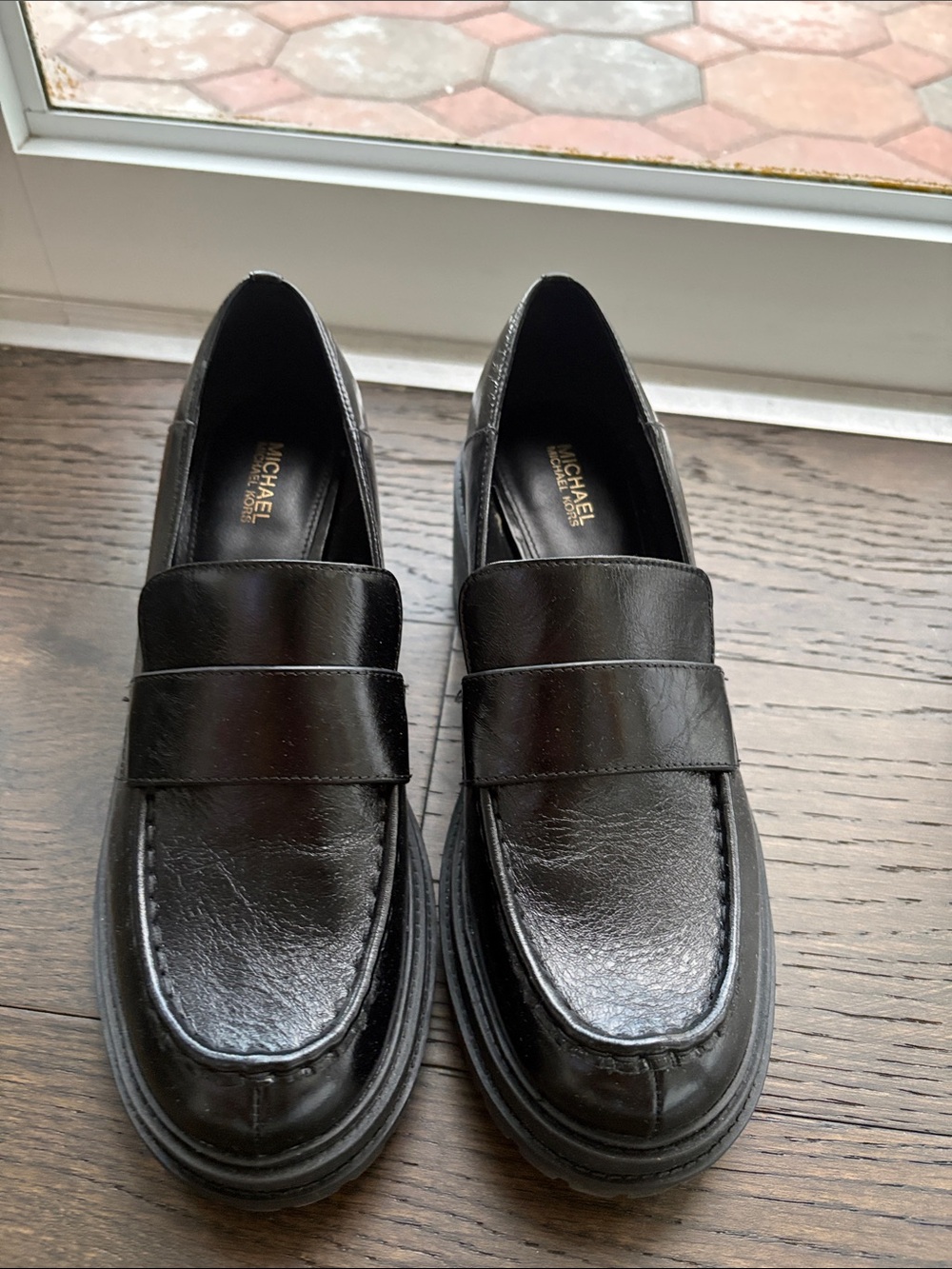 Michael Kors woman’s Black Leather Penny Loafers with Sleek Finish